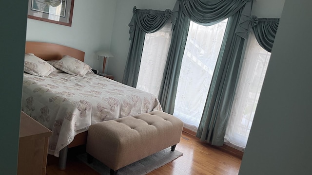 bedroom with wood finished floors