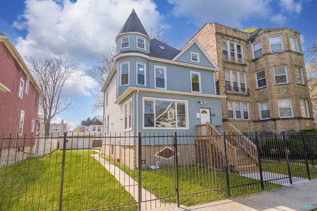 view of front facade with a front yard and a fenced front yard