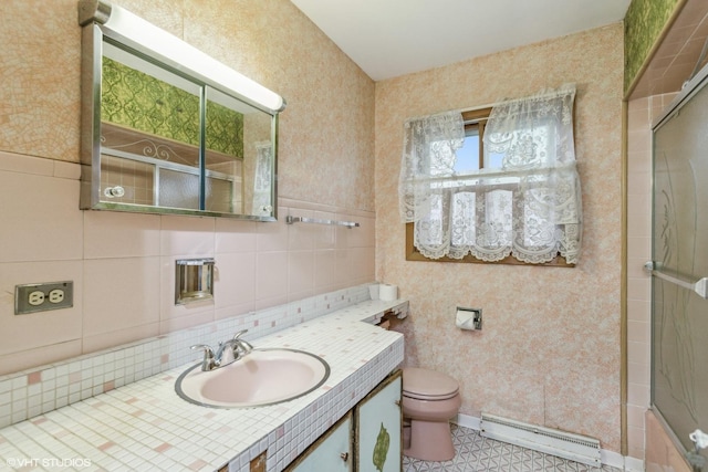 116 E Armitage Ave, Addison, IL 60101 - bathroom with a baseboard radiator, vanity, toilet, wallpapered walls, and tasteful backsplash