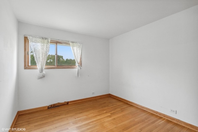 116 E Armitage Ave, Addison, IL 60101 - empty room featuring light wood-style floors and baseboards