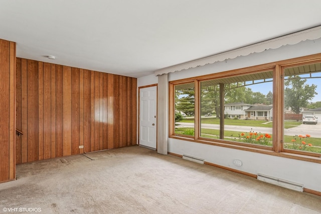 116 E Armitage Ave, Addison, IL 60101 - carpeted spare room with a baseboard heating unit and wood walls