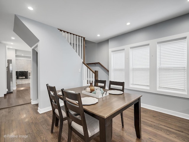 dining area with stairs, recessed lighting, baseboards, and dark wood finished floors