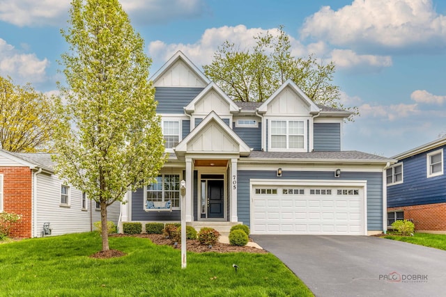 view of front of property featuring a garage, board and batten siding, and driveway