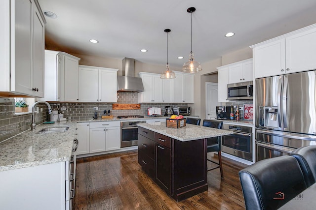 dining room featuring baseboards, recessed lighting, and dark wood finished floors