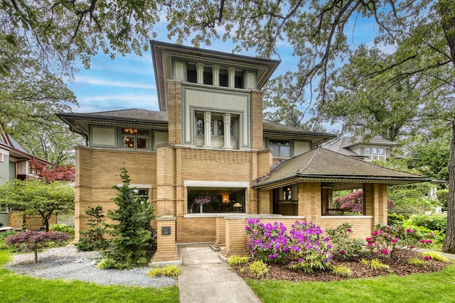 view of front of home featuring brick siding