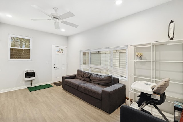 living area featuring recessed lighting, light wood-style flooring, heating unit, and ceiling fan