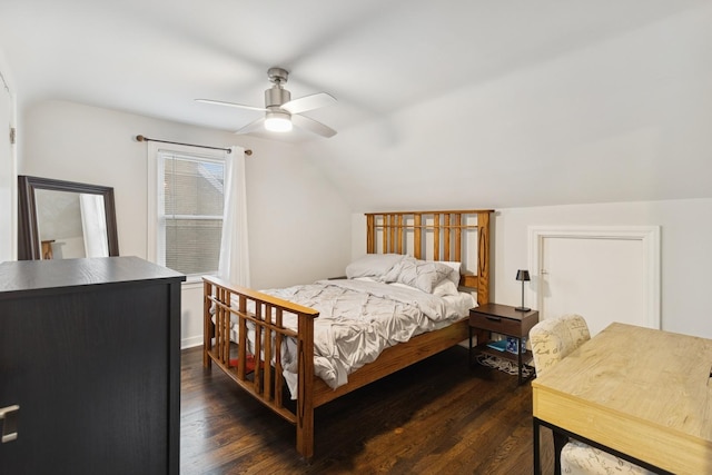 bedroom with a ceiling fan, dark wood-style flooring, and lofted ceiling