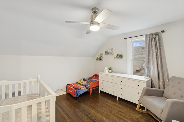 bedroom featuring ceiling fan, vaulted ceiling, and wood finished floors