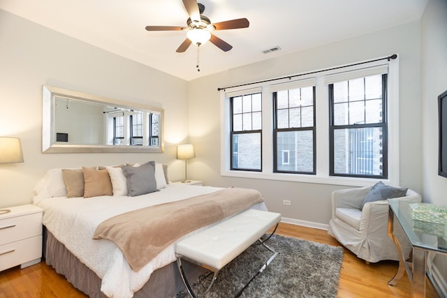 4830 N Albany Ave Unit 1N, Chicago, IL 60625 - bedroom with visible vents, light wood-style flooring, and multiple windows