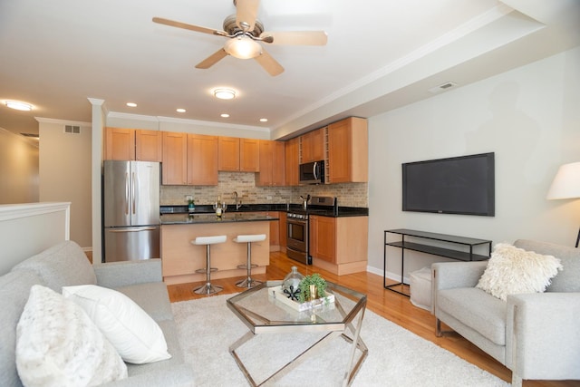 4830 N Albany Ave Unit 1N, Chicago, IL 60625 - living room featuring ceiling fan, light wood-style floors, recessed lighting, visible vents, and ornamental molding