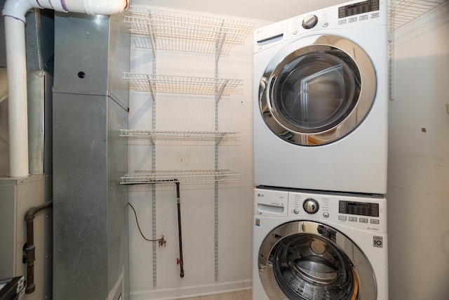 4830 N Albany Ave Unit 1N, Chicago, IL 60625 - clothes washing area featuring heating unit, stacked washer / drying machine, and laundry area