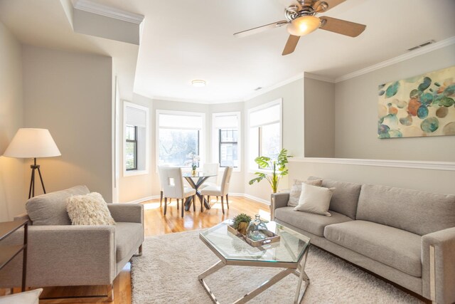 4830 N Albany Ave Unit 1N, Chicago, IL 60625 - living room featuring ornamental molding, light wood finished floors, ceiling fan, and visible vents