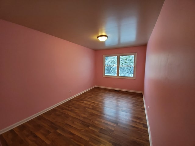 19135 Pine Dr Unit 2, Country Club Hills, IL 60478 - empty room featuring baseboards and dark wood-type flooring