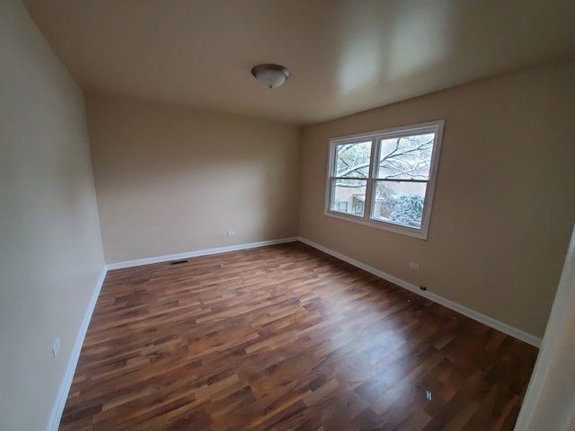 19135 Pine Dr Unit 2, Country Club Hills, IL 60478 - unfurnished room featuring baseboards and wood finished floors
