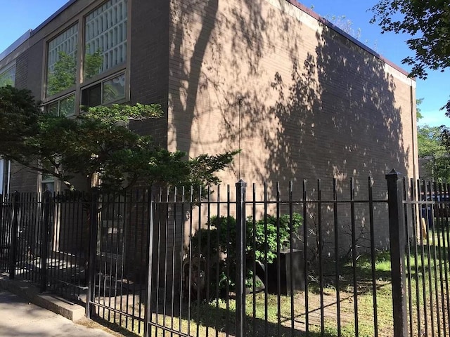 1428 E 55th St, Chicago, IL 60615 - view of gate featuring fence