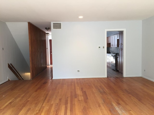 1428 E 55th St, Chicago, IL 60615 - spare room with visible vents and light wood-style flooring