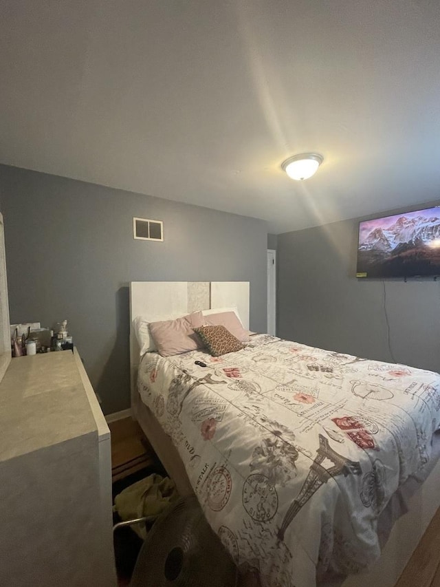 bedroom featuring visible vents