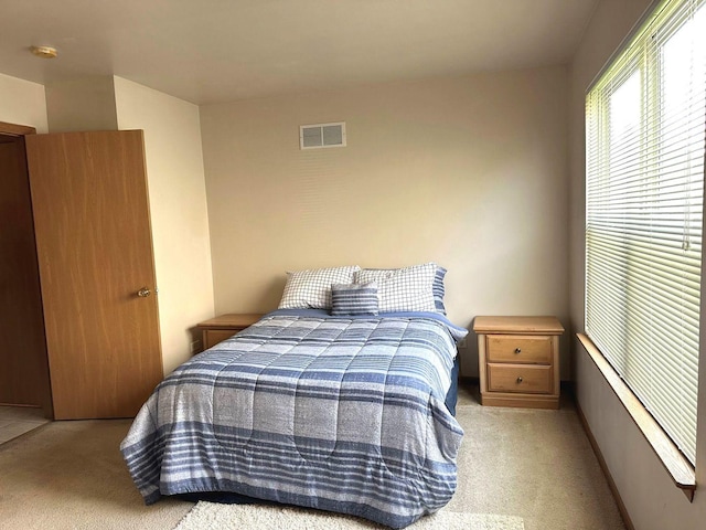 carpeted bedroom with visible vents