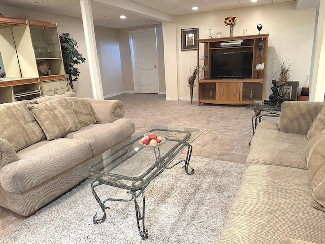 living area featuring baseboards and recessed lighting