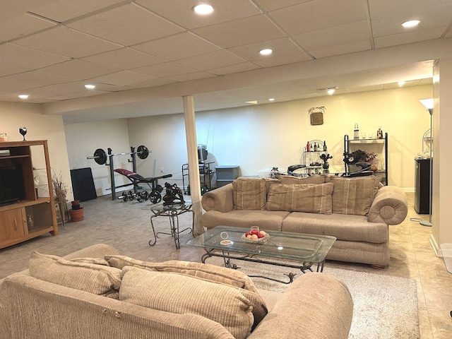 living room featuring recessed lighting and a paneled ceiling