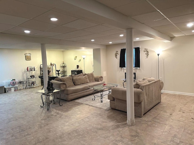 living room with recessed lighting and a drop ceiling