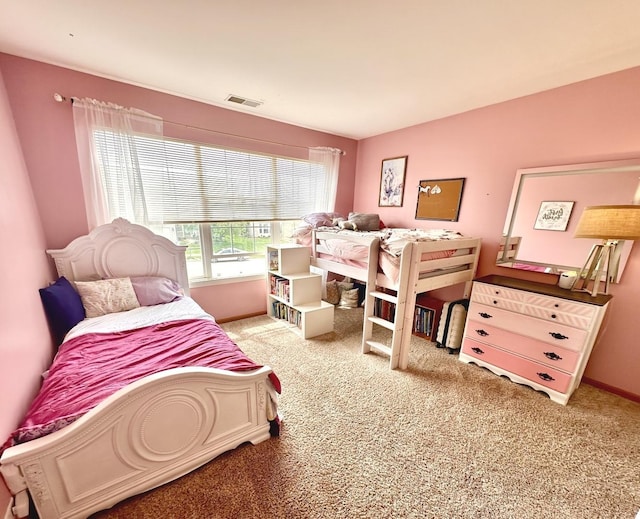 bedroom featuring visible vents, baseboards, and carpet floors