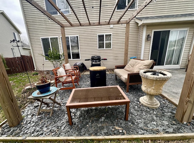 view of patio featuring outdoor lounge area and fence