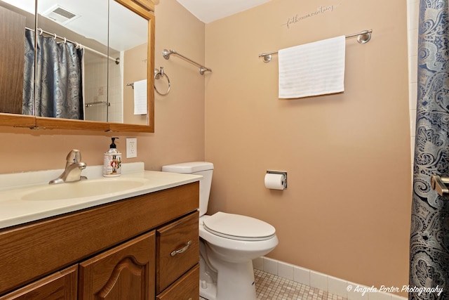 bathroom with vanity, toilet, tile patterned floors, a shower with curtain, and visible vents