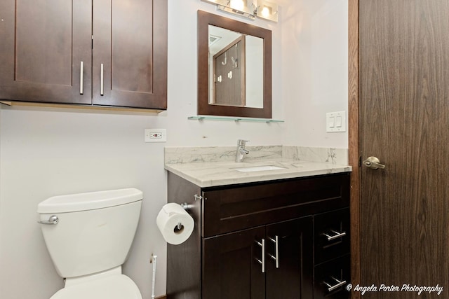half bath with toilet and vanity