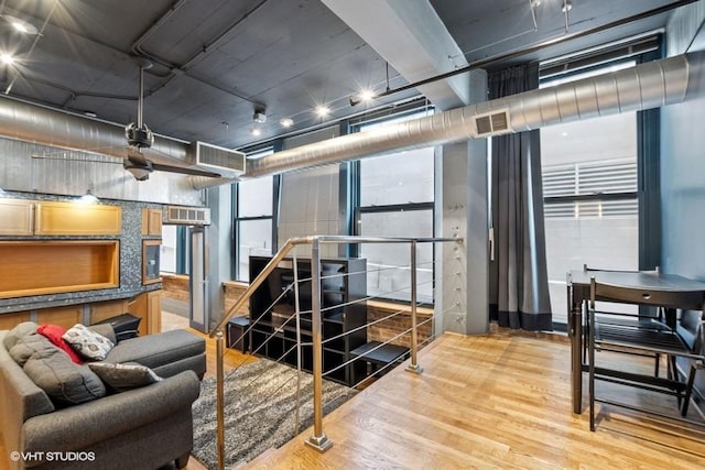 living room featuring visible vents and wood finished floors