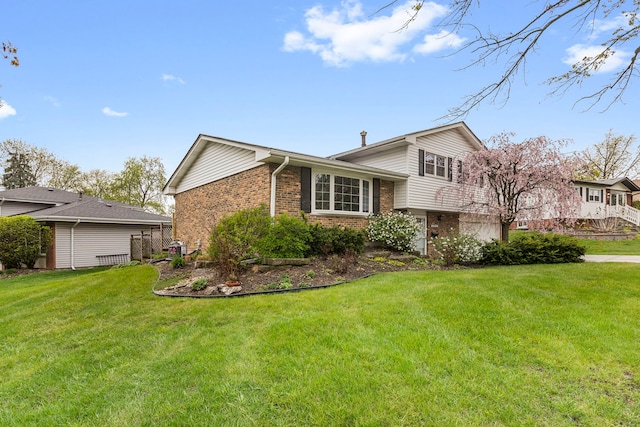 view of home's exterior with a yard and brick siding