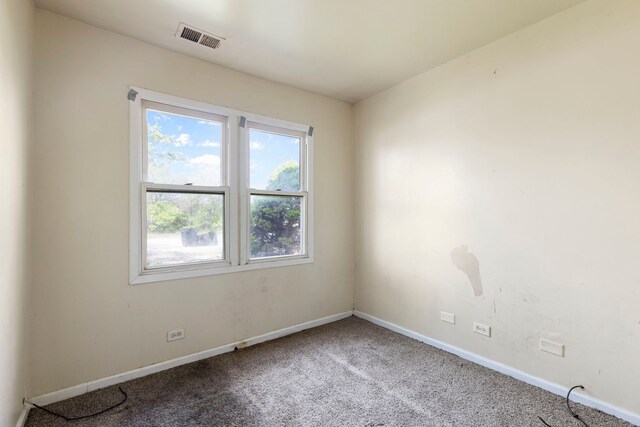 14533 Ashland Ave, Harvey, IL 60426 - empty room featuring visible vents, carpet flooring, and baseboards