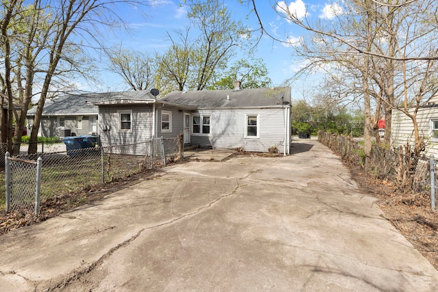 14533 Ashland Ave, Harvey, IL 60426 - back of house featuring fence, driveway, and a chimney