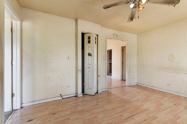 14533 Ashland Ave, Harvey, IL 60426 - unfurnished room with ceiling fan, baseboards, and light wood finished floors