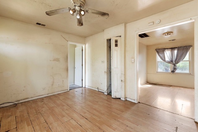 14533 Ashland Ave, Harvey, IL 60426 - spare room with ceiling fan, light wood finished floors, and visible vents