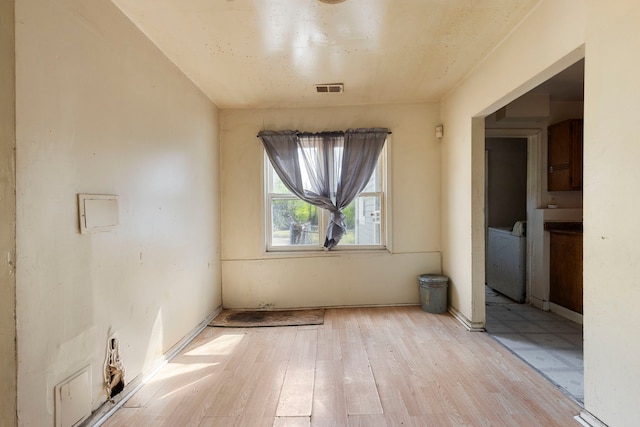14533 Ashland Ave, Harvey, IL 60426 - spare room featuring visible vents and light wood finished floors