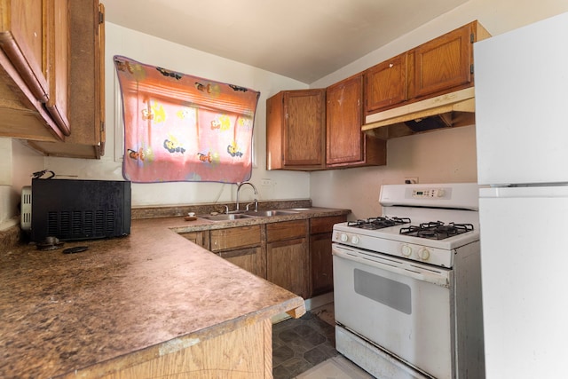 14533 Ashland Ave, Harvey, IL 60426 - kitchen with white appliances, under cabinet range hood, brown cabinetry, and a sink