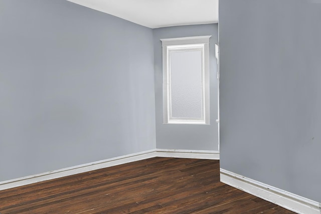 1516 S Homan Ave, Chicago, IL 60623 - spare room with dark wood-type flooring and baseboards
