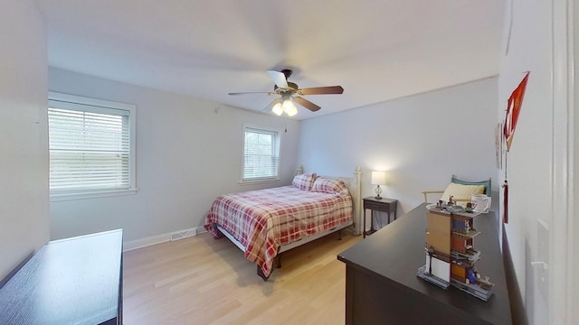 1938 Keim Dr, Wheaton, IL 60189 - bedroom with light wood finished floors, baseboards, and ceiling fan