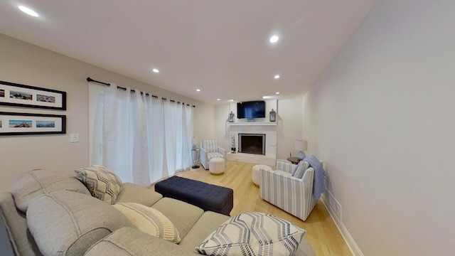 1938 Keim Dr, Wheaton, IL 60189 - living room with a fireplace, light wood finished floors, recessed lighting, and baseboards
