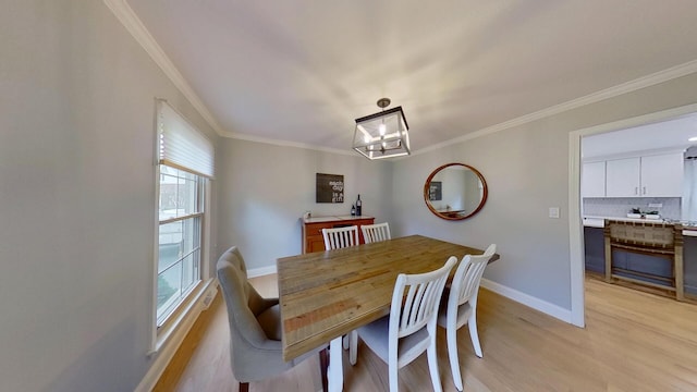 1938 Keim Dr, Wheaton, IL 60189 - dining space with light wood-type flooring, ornamental molding, baseboards, and a chandelier