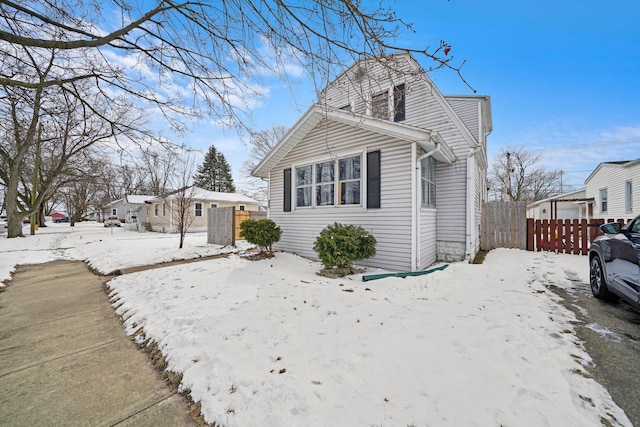 view of front of home featuring fence