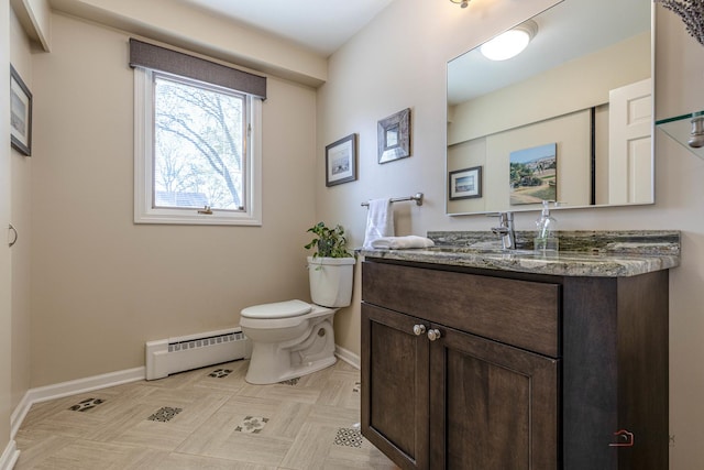 bathroom with baseboard heating, baseboards, toilet, and vanity