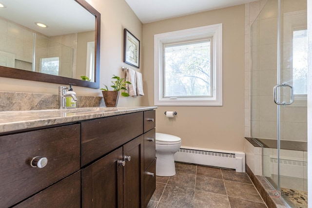 full bath with a baseboard radiator, toilet, and a shower stall