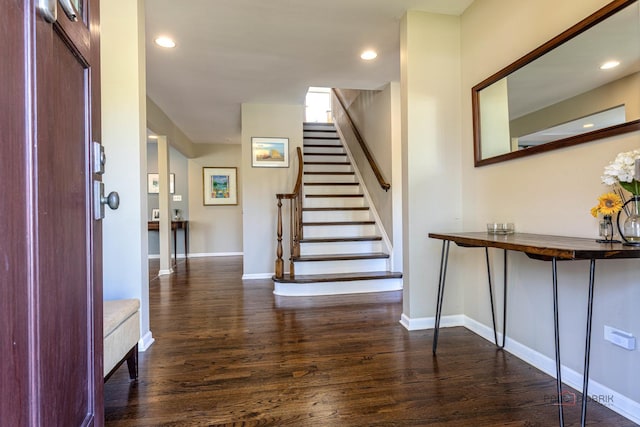 entrance foyer featuring dark wood-style flooring, stairway, baseboards, and recessed lighting