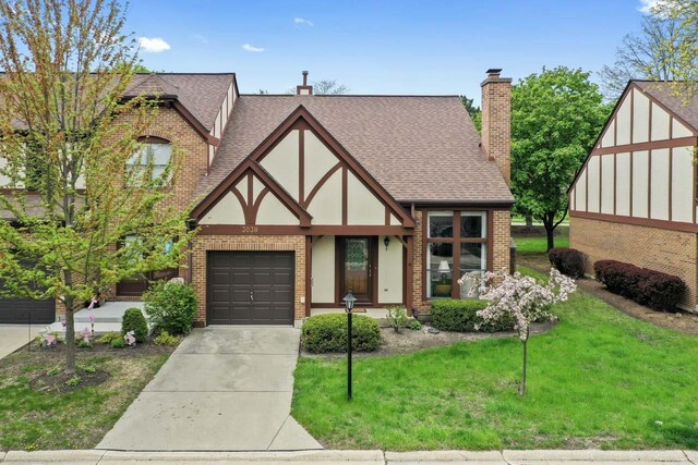 3038 Ashton Ct, Westchester, IL 60154 - english style home with a front lawn, roof with shingles, a chimney, brick siding, and driveway