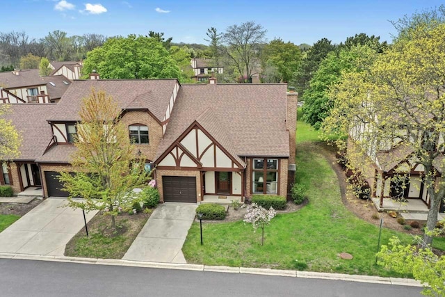 3038 Ashton Ct, Westchester, IL 60154 - english style home featuring driveway, roof with shingles, a front yard, brick siding, and stucco siding