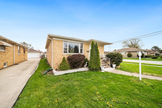 525 Mackinaw Ave, Calumet City, IL 60409 - bungalow-style home featuring brick siding, an outdoor structure, a front lawn, and a garage