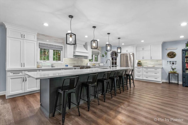 6561 Dunham Rd, Downers Grove, IL 60515 - kitchen with custom range hood, a sink, recessed lighting, decorative backsplash, and white cabinetry