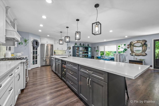 6561 Dunham Rd, Downers Grove, IL 60515 - kitchen featuring appliances with stainless steel finishes, a sink, white cabinets, recessed lighting, and decorative backsplash